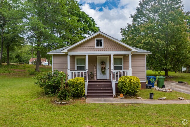 Classic American cottages are a common sight, showcasing the neighborhood's historic roots and inviting architectural style.