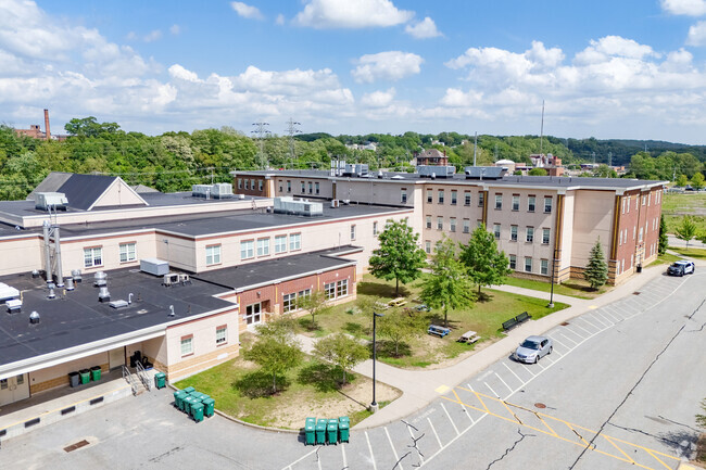 Sleek lines grace the outline and back of Woonsocket Middle School.