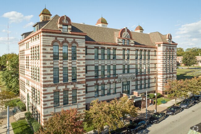 The Louisa May Alcott School, once School No. 59, stands as a historic Park Circle landmark.