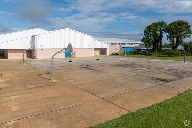 Hill-Gustat Middle School has outdoor basketball courts.