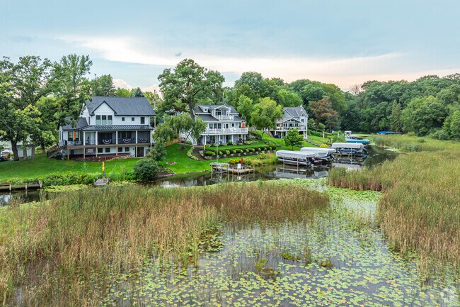 Waterfront homes often include boat docks and expansive lake views.