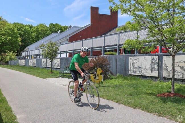 Residents of West Chelmsford can enjoy leisurely bike rides along the scenic Bruce Freeman Rail Trail, where they can admire a variety of vibrant, locally painted murals that add color and character to the journey.