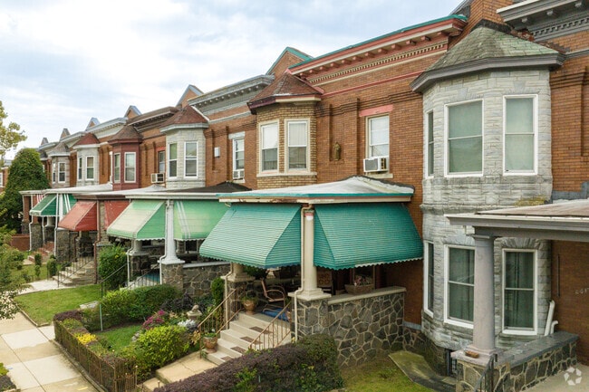 Some row homes in Evergreen Lawn offer quaint front porches.