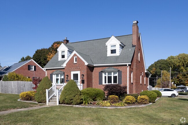 This Cape Cod-style home can be found in the picturesque neighborhood of Frontier.