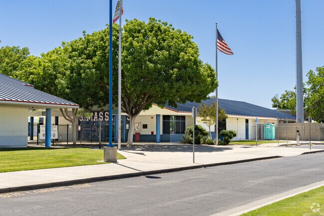 An American flag waves high above the entrance to Joseph M. Simas Elementary School.