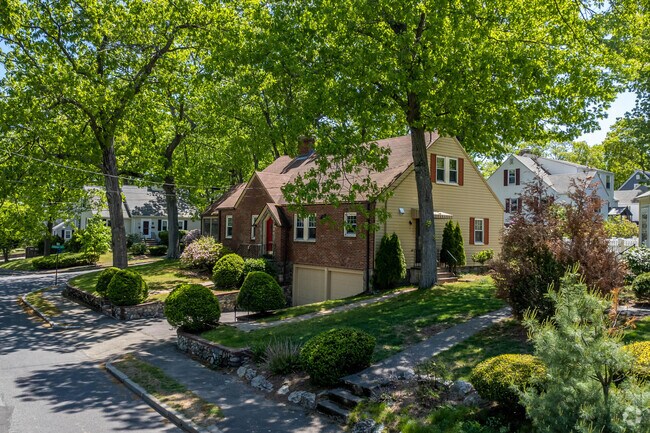 Home with double garage on Roundwood Rd in Newton Upper Falls.