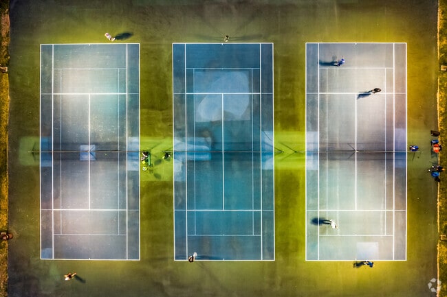 The tennis courts at Baker Park are lit through the night, perfect for that late night match.