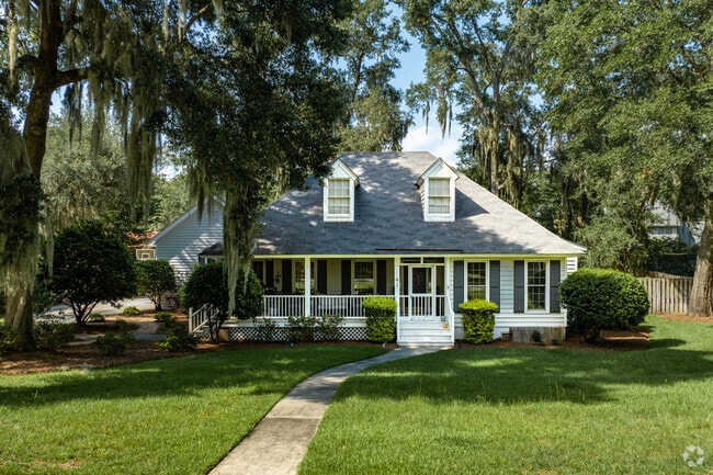 Cape Cod style homes in the neighborhood sit on lots with well maintained lawns.