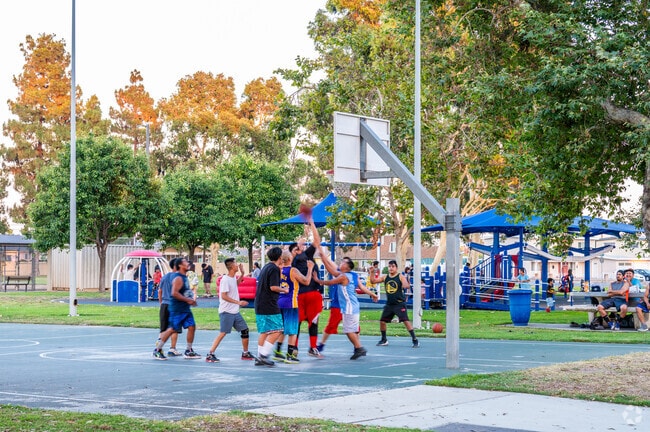 Active residents in Little Saigon play some basketball at Westminster Park.