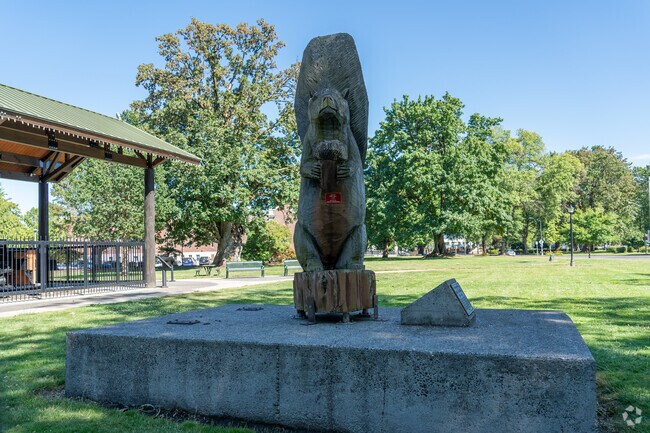 Discover Glenwood's charming park with its unique squirrel statue and historic train display.
