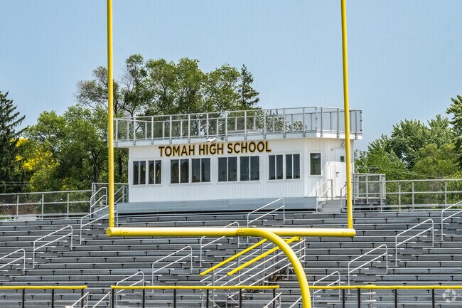 Tomah High School offers extracurricular activities, including varsity football.