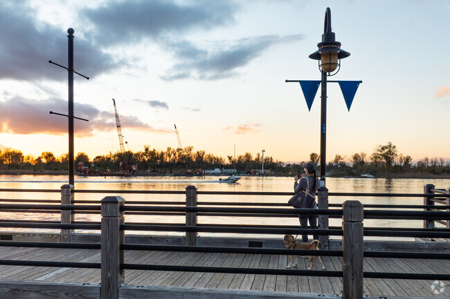 Residents and tourists enjoy sunset walks along Cape Fear River in Wilmington.