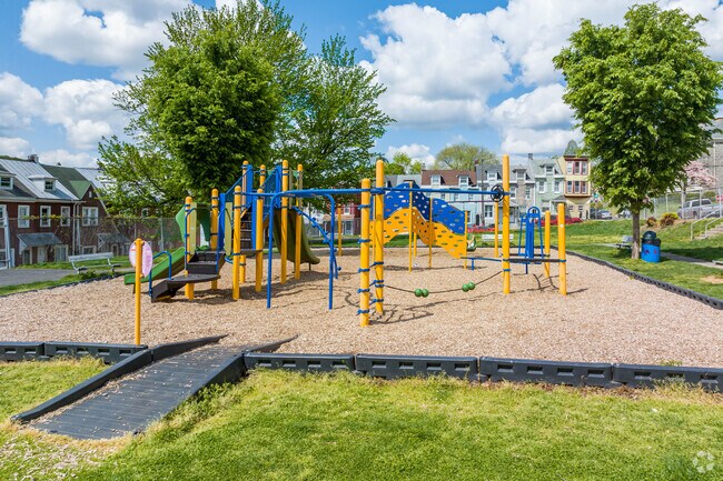 The 16th and Haak Playground features a colorful play structure.