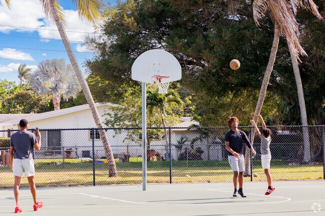 Roosevelt Estates kids joyfully playing on the courts of Gaines Park.