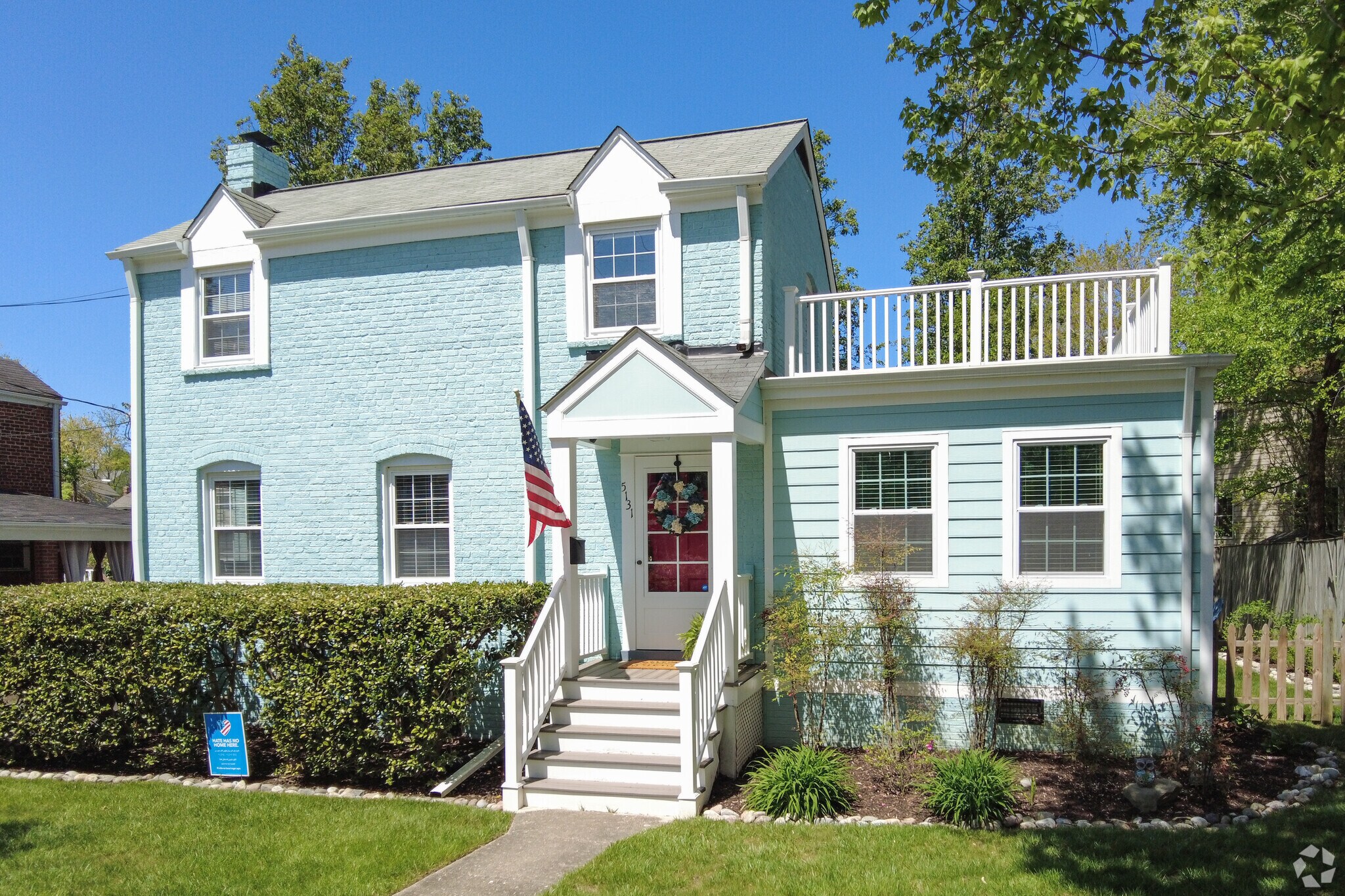 Colorful split-level colonial-style home in the Yorktown neighborhood.