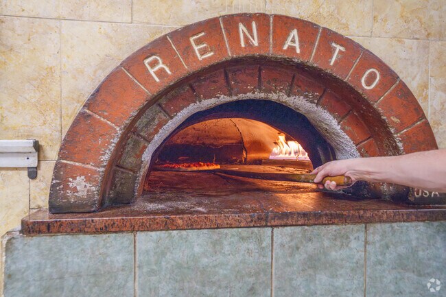 Wait with excitement for a mouth-watering pizza from the brick oven at CC Tomatoes in Penacook.