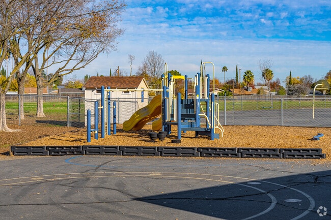 Small children love the small play structure of Sierra View Elementary School.