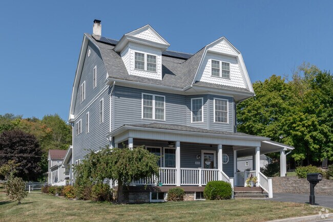 Graciously renovated, an elegant farmhouse anchors the street in East Juniata.