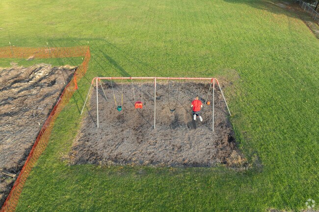 Children use the swings at Smith Park in Northfield, Ohio.