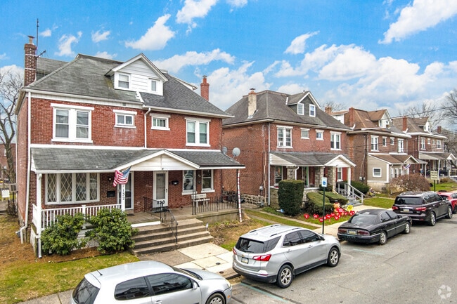 Clifton Heights dwellings are typically attached single-family homes with brick exteriors.