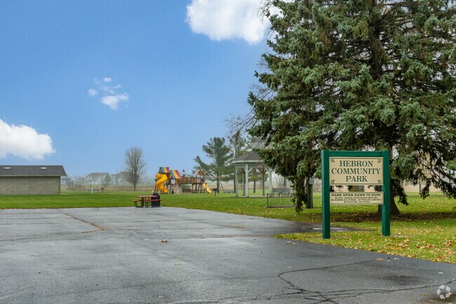 Hebron Community Park has a playground and shaded seating area in Hebron-Aldon.