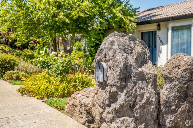 This home uses a rock on the property to house its mailbox in Country Heights.