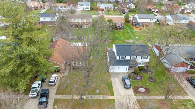 Smaller yards in Fairmeade are enhanced by meticulous landscaping and mature trees.
