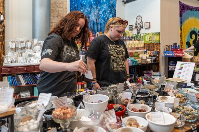 Patrons of the metaphysical shop, Be of Good Ju Ju, browse the selection of crystals & stones.