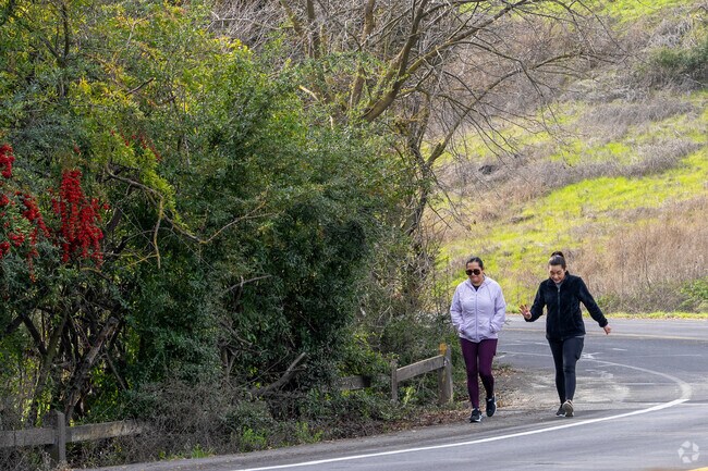 Neighbors in Chantillery enjoy a relaxed walk along quiet, winding streets lined with greenery.