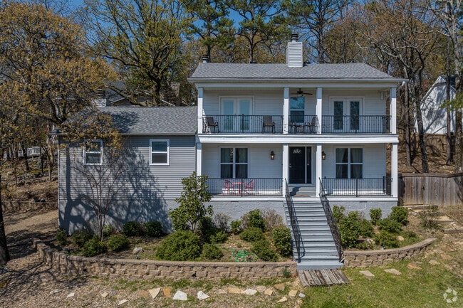 A farmhouse sits atop a stone terrace in the Rock Creek neighborhood.