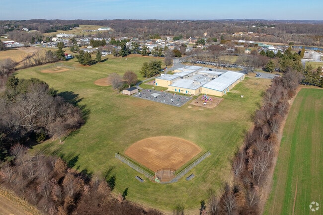 There are blacktops and baseball fields at Lisbon Elementary School.