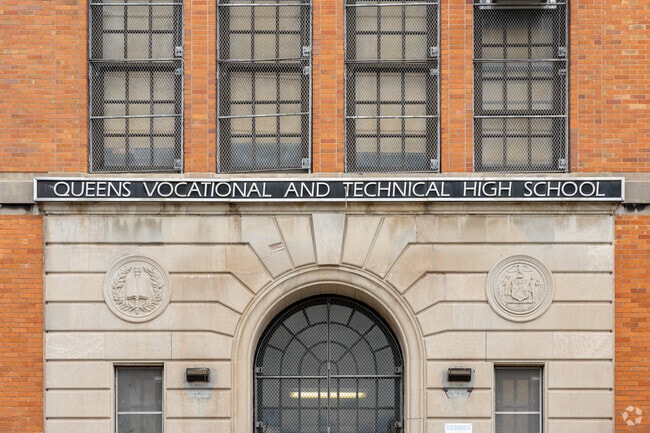 Queens Technical High School signage.