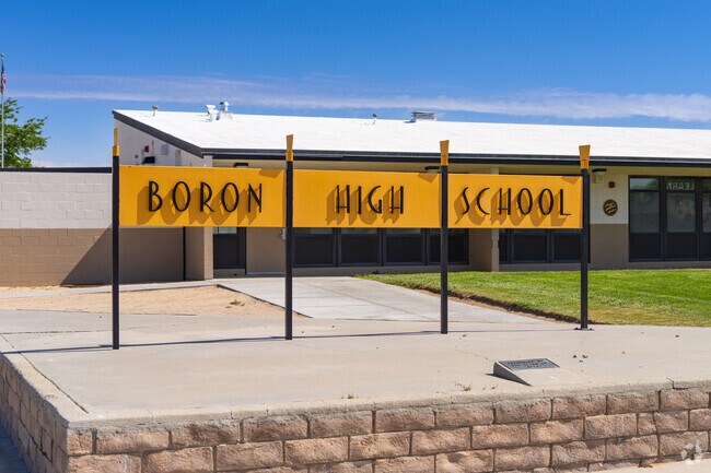 A bright yellow sign outside Boron High School greets parents and students.