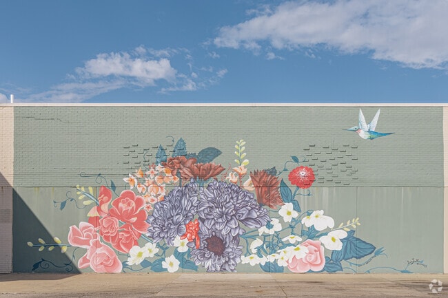 Murals decorate the facade of Markland Mall in Markland Heights.