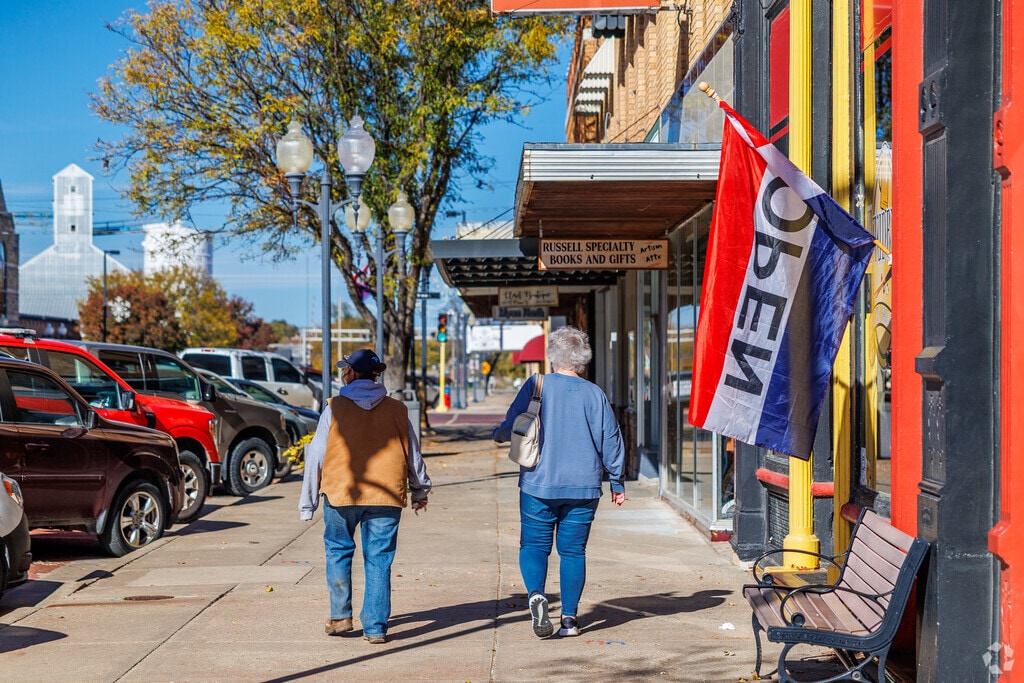 Residents stroll Russell’s historic brick-paved downtown.