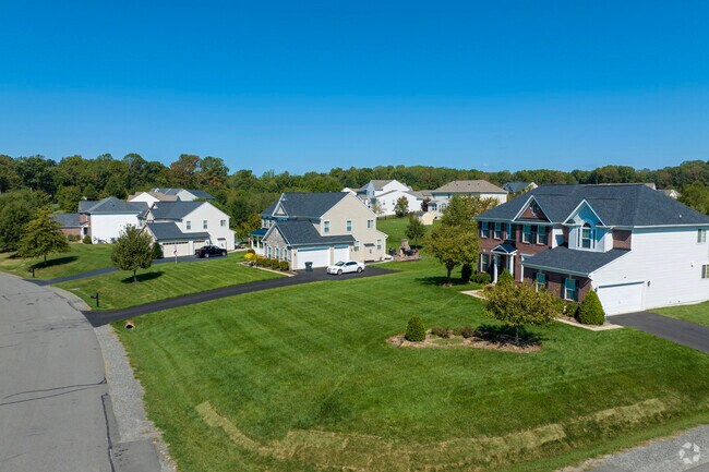 Spacious homes in Powells Creek feature expansive lawns and mature landscaping.