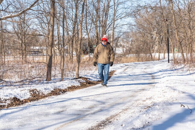 A resident takes a stroll down the winding trail inside of Shonas Highlands Park.