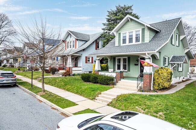 These classic craftsman homes are finished in different colors to show off their owners' tastes.