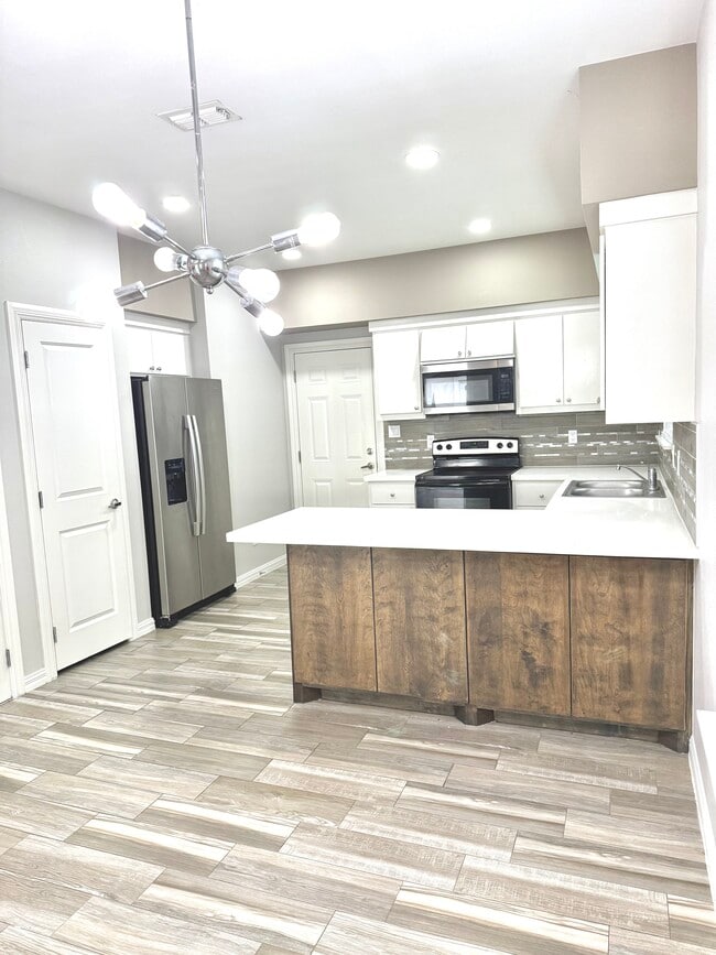 Luxury finishes like quartz countertops, tile floors