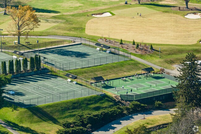 Hurstbourne Country Club also features amenities like tennis courts.