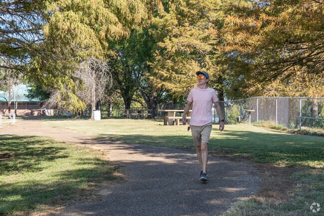 The neighborhood features several parks with trails and green spaces.