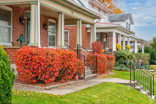 Large front porches with colorful foliage and clean landscaping are welcoming in Longswamp.
