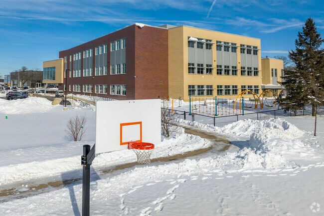 Badger Rock Middle School in Madison has sports areas in the back, connected to Badger Park.