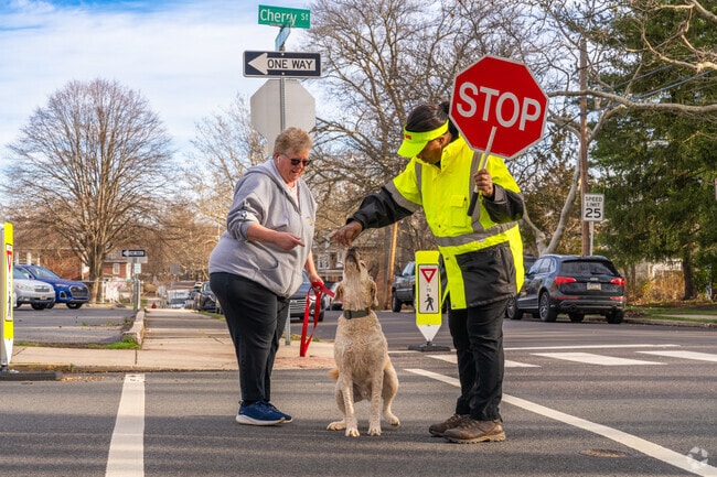 Neighbors in East End South are greeted by the friendly crossing guards to Rupert Elementary.