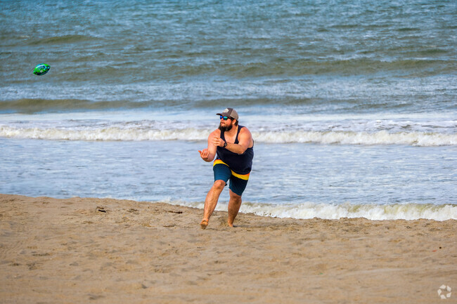 A Cape Canaveral visitor enjoys playing catch on the scenic beach.
