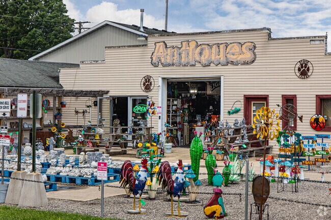 A local antiques shop displays colorful art along its rustic storefront in Davis Junction.