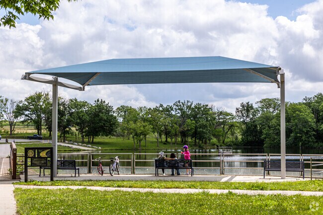 Cameron Reservoir connects to a densely wooded trail that wraps around the reservoir.