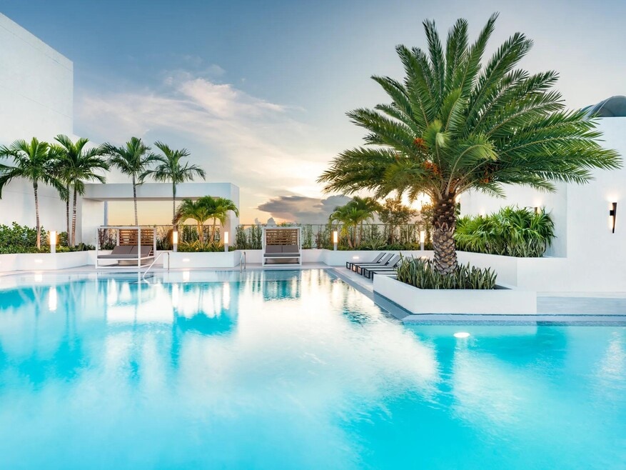 Sunset reflections and tropical palms make Modera Riverside’s rooftop pool an elegant Miami destination.