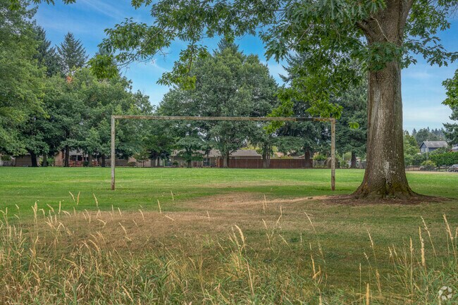 Soccer fields at Oakbrook Park host games and practices in a wooded neighborhood setting.