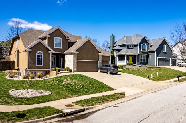 Homes in Lake Waukomis have larger driveways to make room for the whole family.